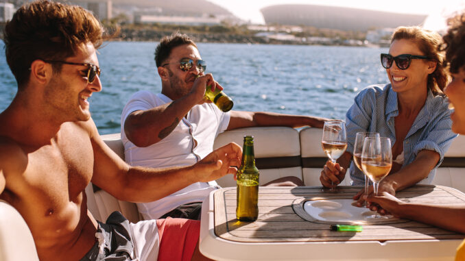 Happy friends having boat party
